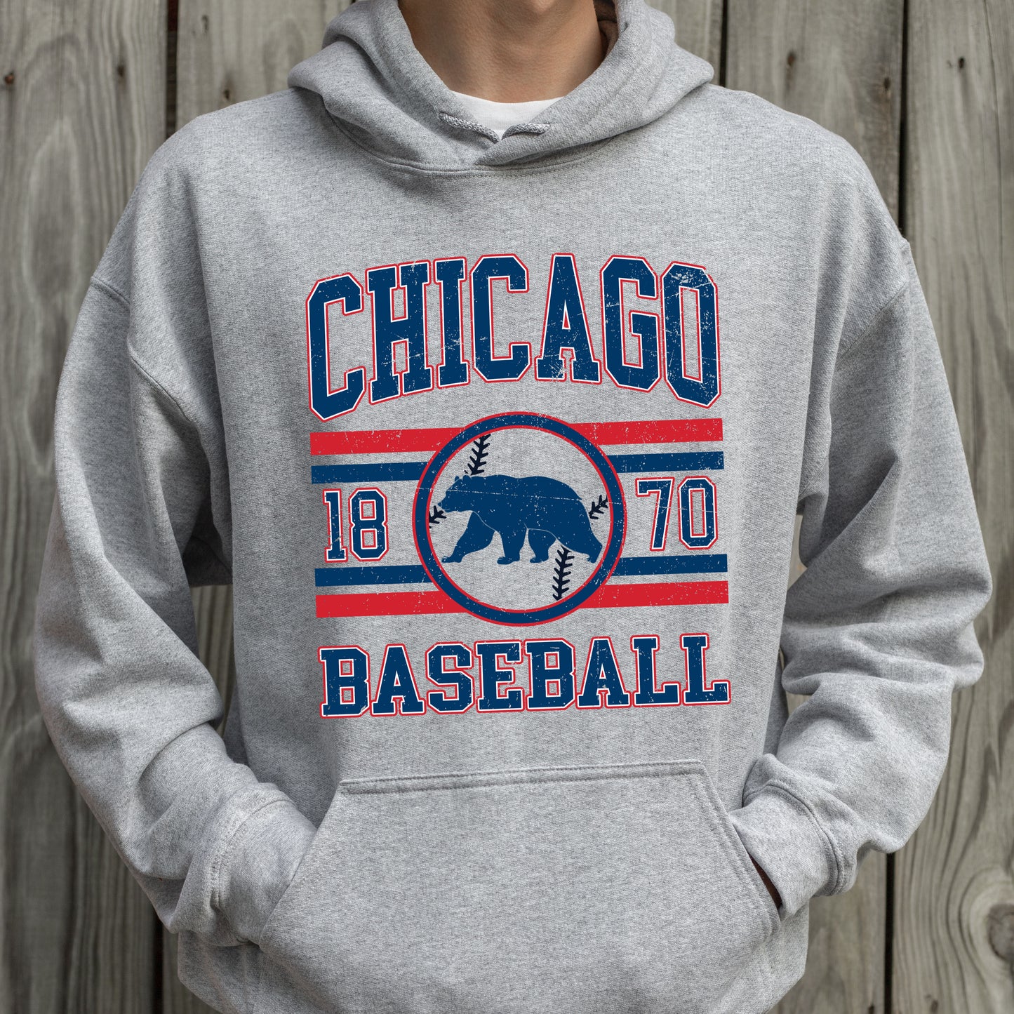 Gray hoodie with 'Chicago Baseball' text and bear logo on a wooden background