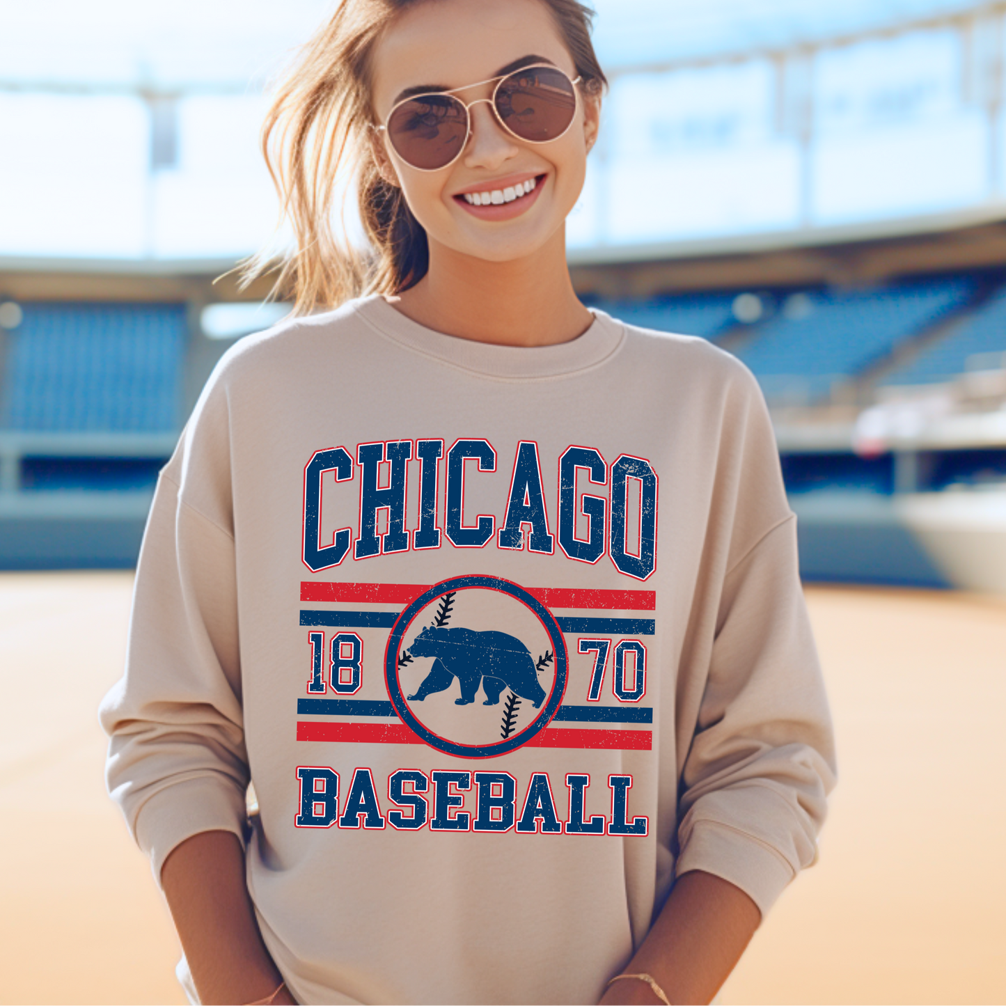Woman wearing a 'Chicago Baseball' sweatshirt at a stadium.