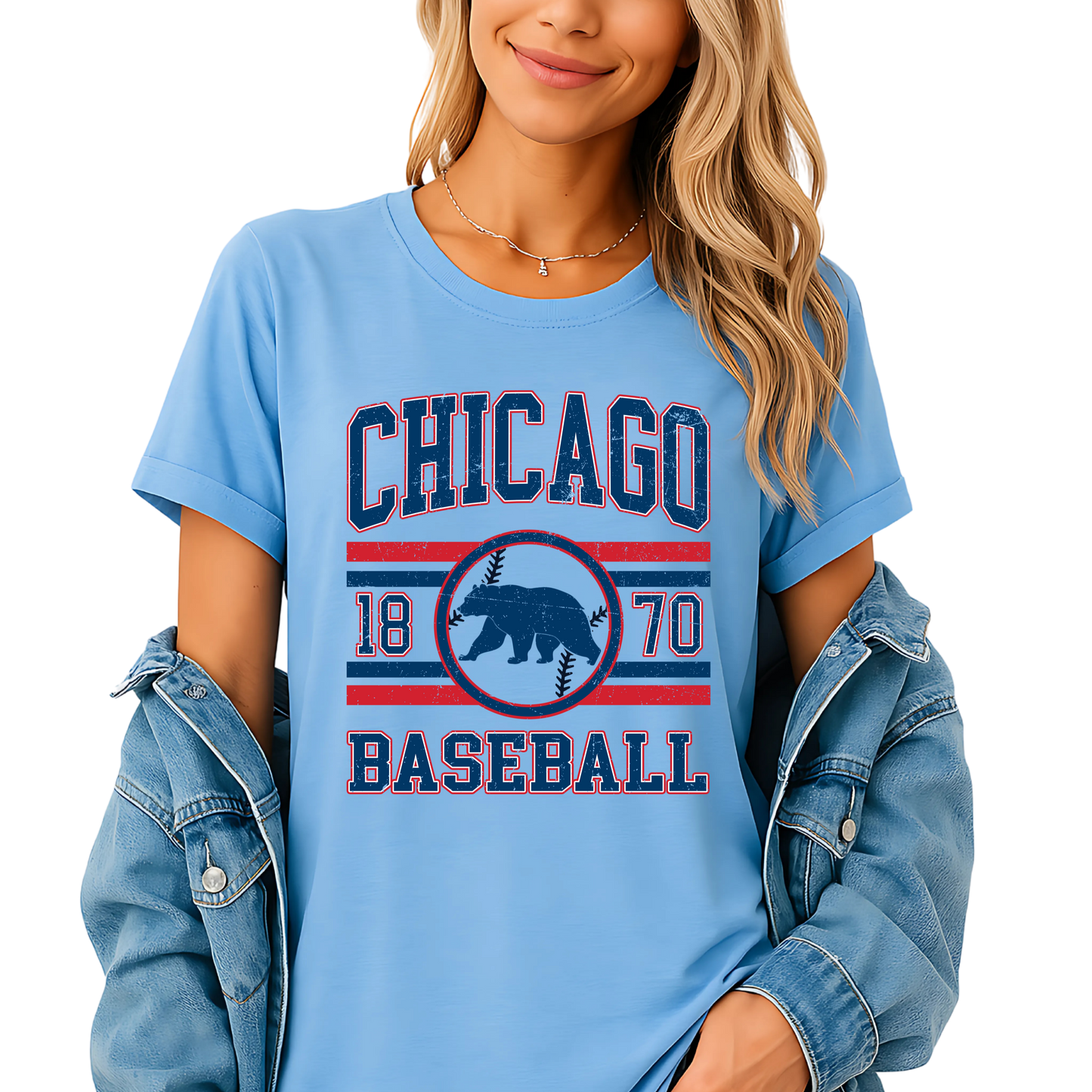 Woman wearing a light blue 'Chicago Baseball' t-shirt with a denim jacket and shorts on a white background